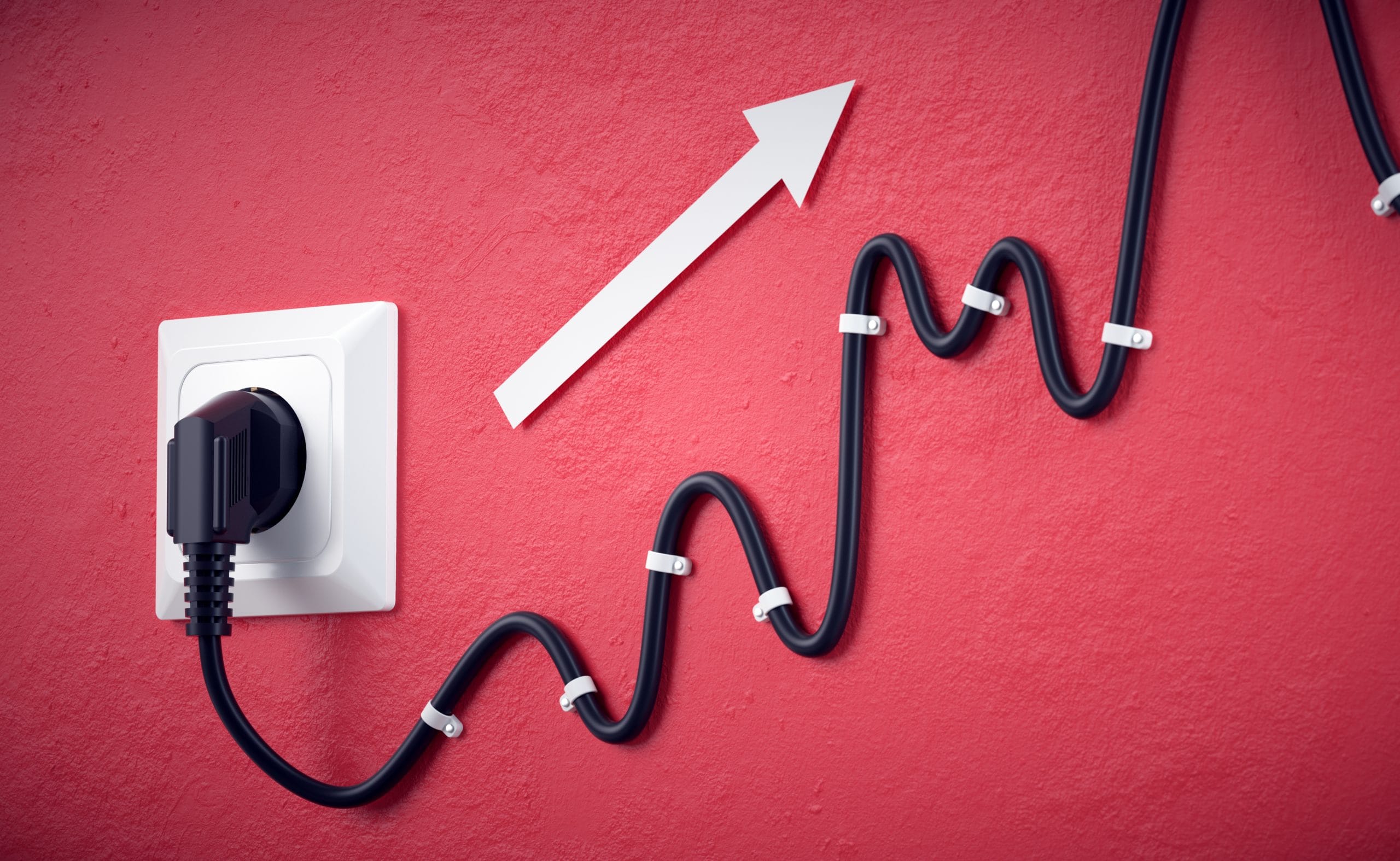Foto zeigt ein Kabel in einer Steckdose an der Wand, das Kabel geht von der Steckdose wellenförmig nach oben. Zusätzlich zeigt ein Pfeil nach oben. Foto von Negro Elkha (stock.adobe.com).