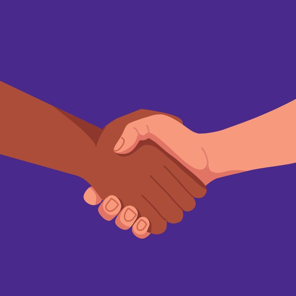 Zwei Personen geben sich die Hand.